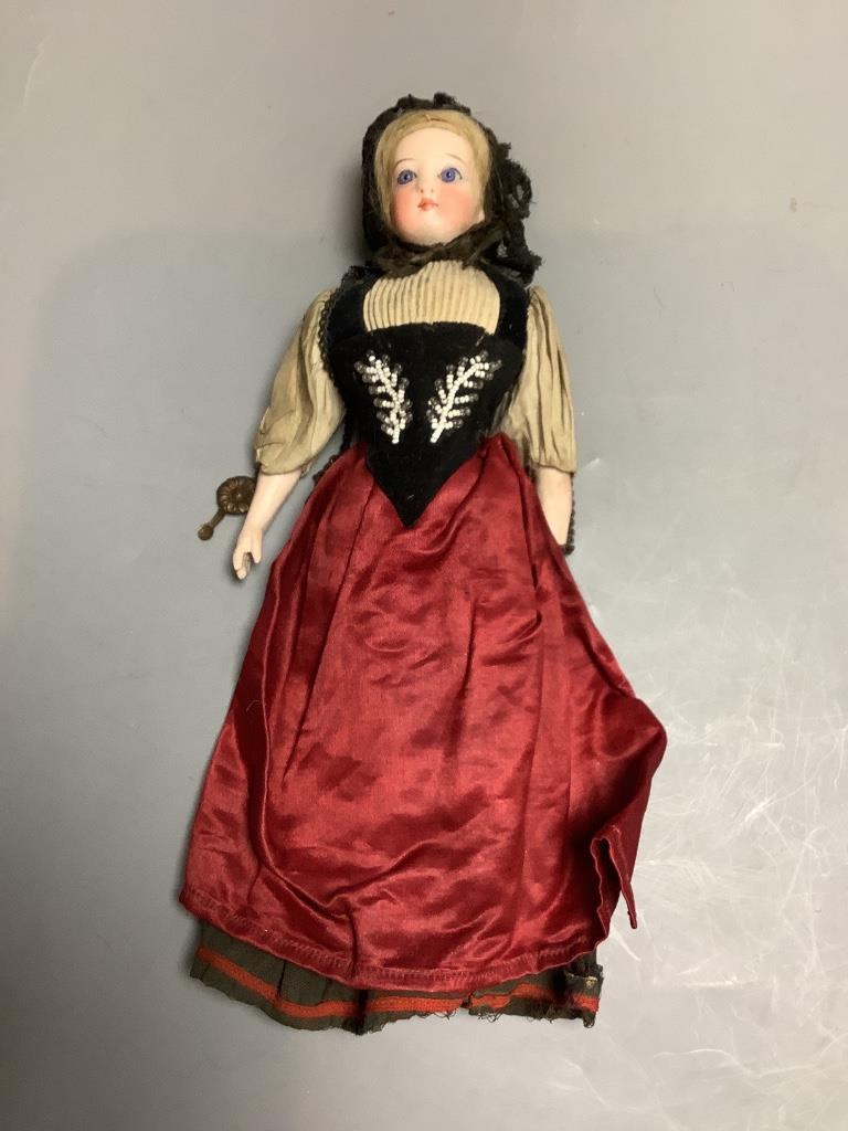 A costume doll, bisque shouler plate, height 25cm